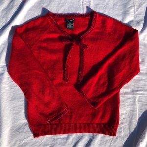 Sparkly red bow on red sweater sz L